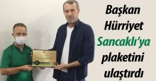 Başkan Hürriyet, Sancaklı’ya plaketini ulaştırdı